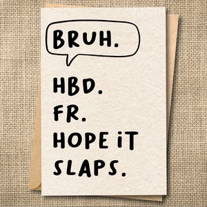 May include: A greeting card with the text "BRUH." in a speech bubble, followed by "HBD. FR. HOPE IT SLAPS." in a bold, black font. The card is light beige and is inside a brown envelope.