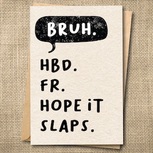 May include: A greeting card with a tan background and a brown envelope. The card features the word "BRUH" in a black speech bubble, and the phrases "HBD. FR. HOPE IT SLAPS." in black text.