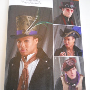 May include: A sewing pattern for four different hats, including a top hat with a feather, a steampunk-style hat with goggles, a wide-brimmed hat with a blue feather, and a small, round hat with a burgundy and gold design. The pattern is from Simplicity and is numbered 8713.