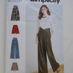 May include: Simplicity sewing pattern number S9682 for sizes US 14-22, Euro 40-48, and French 42-50. The pattern includes instructions for making four different garments: a floral print skirt, a red skirt, a pair of blue wide-leg pants, and a plaid skirt.