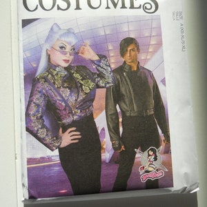 May include: A sewing pattern for a costume with a black leather jacket and a purple and gold brocade jacket. The pattern is from McCall's and the pattern number is M8188. The pattern is for sizes XS-XL.