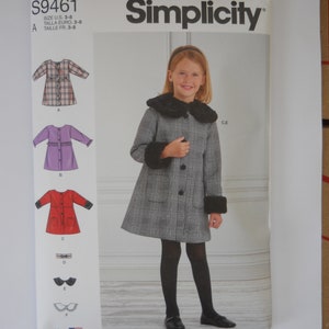 May include: Simplicity sewing pattern number S9461 for girls' coats and dresses. The pattern includes instructions for making a plaid coat with a fur collar and cuffs, a plaid dress, a purple dress, and a red dress. The pattern is for sizes 3-8.