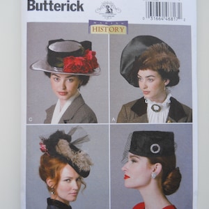 May include: A vintage sewing pattern for four different hats. The pattern is from Butterick and is numbered B6397. The hats are all different styles, including a cloche hat, a wide-brimmed hat, a small hat with a veil, and a small hat with a feather.