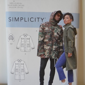 May include: Simplicity sewing pattern number S9052, Mimi G Style, for a hooded jacket with pockets. The pattern includes two different styles, one with a camouflage print and one in a solid color. The pattern is for sizes XS-XL.
