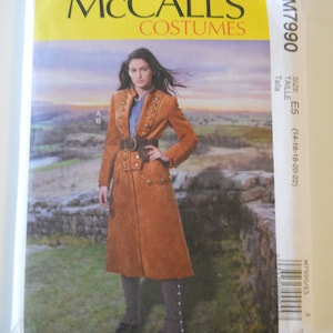 May include: A McCall's Costumes sewing pattern for a brown, long-sleeved coat with gold buttons and a belt. The pattern number is M7990 and the size is E5 (14-16-18-20-22).