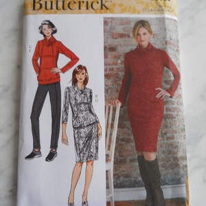 May include: A sewing pattern from Butterick, pattern number B6858, for a dress and a top. The pattern includes three different views, with a red dress, a red top, and a gray top. The pattern is for sizes 22 (US) to 26 (US) and includes instructions for sewing the garments.