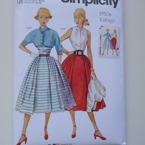 May include: Simplicity sewing pattern envelope for a 1950s vintage dress. The pattern is for sizes 16-24 and features two women wearing dresses with different patterns. The envelope is white with red and black text.