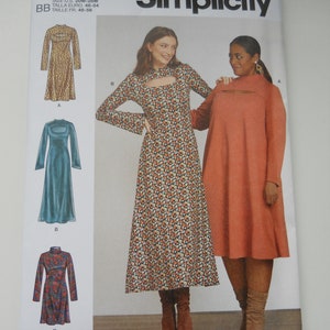 May include: Simplicity sewing pattern number S9644 for sizes 20W-28W. The pattern includes instructions for making three different styles of dresses: a long-sleeved dress with a keyhole neckline, a long-sleeved dress with a high neckline, and a long-sleeved dress with a round neckline. The pattern is designed and printed in the USA.