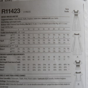 May include: A sewing pattern for misses' dresses and a top. The pattern includes instructions and measurements for sizes 6-24. The pattern is labeled R11423 and is easy to follow.