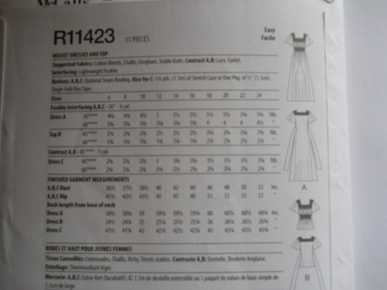 May include: A sewing pattern for misses' dresses and a top. The pattern includes instructions and measurements for sizes 6-24. The pattern is labeled R11423 and is easy to follow.