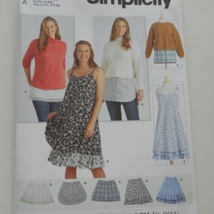 May include: Simplicity sewing pattern S9730 for sizes S-XXL. The pattern includes instructions for making a variety of tops and skirts. The pattern is easy to sew and includes a variety of styles to choose from.