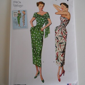 May include: Simplicity sewing pattern number S8876 BB for 1940s vintage dresses. The pattern includes two dress styles, one with a green polka dot print and the other with a floral print. The pattern is for sizes 20W-28W.