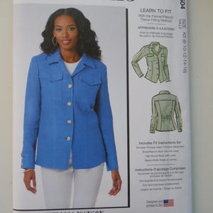May include: McCall's sewing pattern M8504 for sizes K5 (8-10-12-14-16) featuring a blue blazer with a white shirt underneath. The pattern includes instructions for a tissue fitting method, shoulder princess seam, full bust adjustment, broad/narrow back, high round back yoke, and sleeve width adjustment. The pattern is designed and printed in the USA.