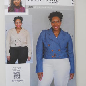 May include: A sewing pattern for a cropped jacket with a double breasted closure and a belt. The pattern is called "Know Me" by Mimi G and is for sizes 10-12-14-16-18. The pattern includes a QR code for a sew-along video tutorial.