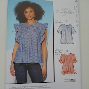 May include: Sewing pattern for a women's blouse with a ruffled neckline and short sleeves. The pattern includes instructions for making pintucks and using elastic with bias tape casing. The pattern is for sizes LRG-XLG-XXL. The pattern is designed and printed in the USA.