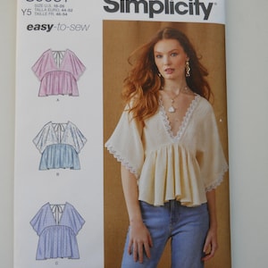 May include: Simplicity sewing pattern S9951 for a women's blouse with a V-neck and flutter sleeves. The pattern includes three different styles: A, B, and C. The pattern is easy-to-sew and is designed and printed in the USA.