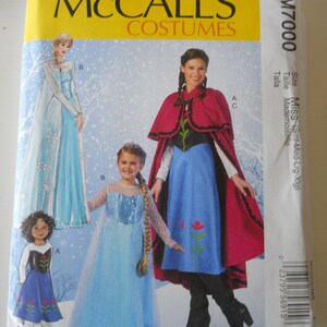May include: Sewing pattern for a Frozen costume. The pattern includes instructions for making a blue dress with a cape, a blue dress with a cape and a blue dress with a cape.