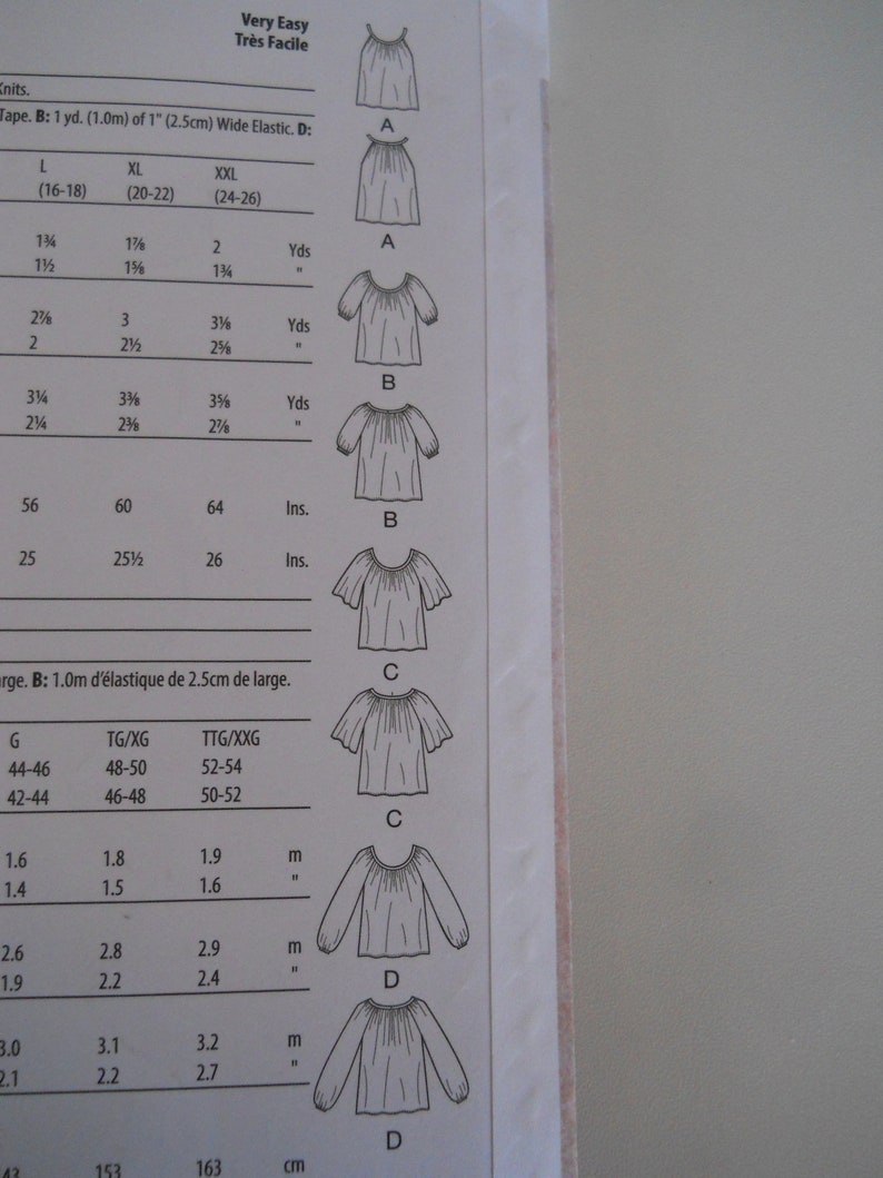 May include: A sewing pattern for a simple, loose-fitting blouse with different sleeve lengths. The pattern includes instructions for sizes L, XL, XXL, and a chart with measurements in inches and yards.