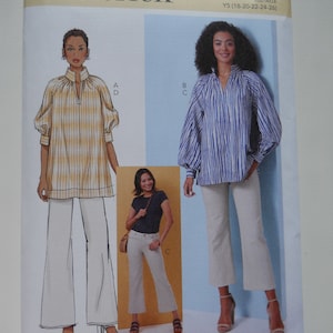 May include: A sewing pattern for a women's blouse with a V-neck and long sleeves. The pattern is from Butterick and is size Y5 (18-20-22-24-26).
