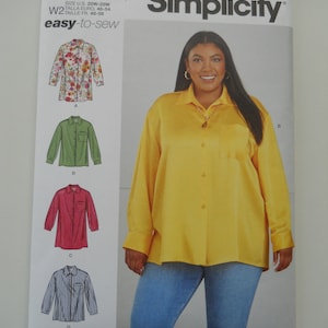 May include: Simplicity sewing pattern number S9708, easy-to-sew, for sizes US 20W-28W, Euro 46-54, and French 48-56. The pattern includes instructions for making a long-sleeved shirt with a button-up front and a patch pocket. The model is wearing a yellow shirt with blue jeans.