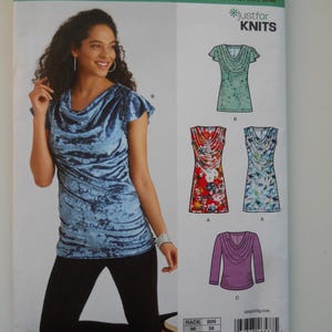May include: A sewing pattern for a cowl neck top with short sleeves. The pattern is for sizes 6-18 and includes three different views. The pattern is from New Look and is called "Just for Knits".