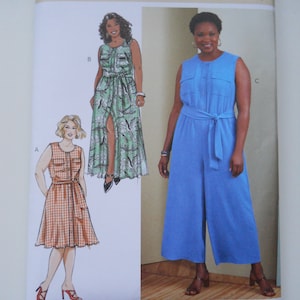 May include: A sewing pattern for a dress and jumpsuit. The pattern is for sizes 26W-28W-30W-32W. The dress is a maxi dress with a floral print and a side slit. The jumpsuit is a blue wide-leg jumpsuit with a tie belt.