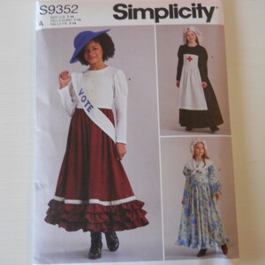May include: Simplicity sewing pattern number S9352 for girls' costumes. The pattern includes three different costumes: a red and white suffragette dress with a "VOTE" sash, a white and black nurse dress with a red cross, and a blue and white colonial dress with a white collar.