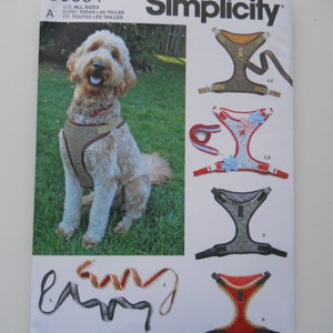 May include: A Simplicity sewing pattern for making dog harnesses. The pattern includes five different styles of harnesses, including a basic harness, a harness with a floral design, and a harness with a quilted design. The pattern also includes instructions for making a leash.