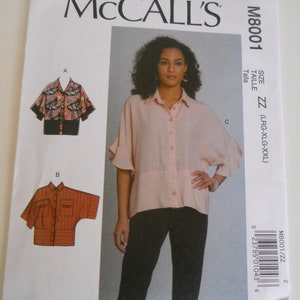 May include: A sewing pattern for a women's blouse with a button-down front and a relaxed fit. The pattern is from McCall's and is size ZZ (LRG-XLG-XXL).