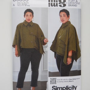 May include: A Simplicity sewing pattern for a cape, with a QR code for a sew-along tutorial by Mimi G. The pattern is for sizes XS-XXL and is part of the "mi.g - A DIY & Lifestyle Brand" line.
