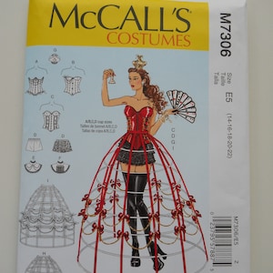May include: A sewing pattern for a red and black corset and a large, multi-tiered hoop skirt. The pattern is from McCall's Costumes and is for size E5 (14-16-18-20-22).