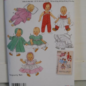 May include: Simplicity sewing pattern number 4707 for making clothes for baby dolls. The pattern includes instructions for making a pink and white gingham dress, a red and white polka dot overall dress, a white dress with a ruffled collar, a green coat, a green dress with a white lace trim, and a white dress with a ruffled collar and a pink sash. The pattern is designed by Teri.
