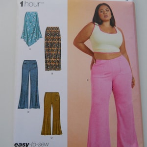 May include: Simplicity sewing pattern S9752 for sizes 20W-28W. The pattern includes instructions for making a pair of wide-leg pants, a skirt, and a top. The pattern is easy to sew and takes about one hour to complete.