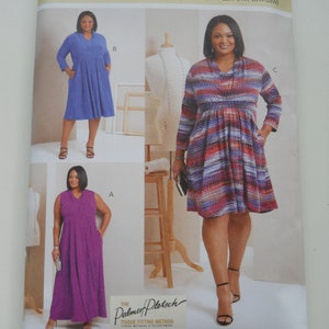 May include: A sewing pattern for a dress with three different styles. The pattern is for sizes 20W-28W. The dress is shown in three different colors: purple, blue, and red and white striped. The pattern is from Butterick and uses the Palmer/Pletsch tissue fitting method.