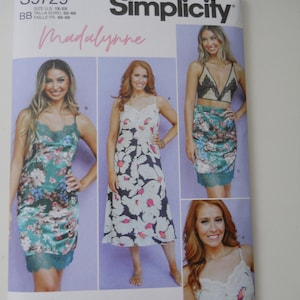 May include: Simplicity sewing pattern number S9729, titled "Madalynne", for a slip dress with lace trim. The pattern includes three different styles of the dress, with floral prints in pink, white, and green.