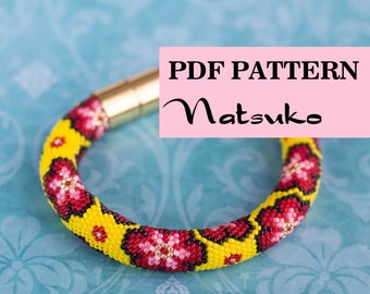 May include: A beaded bracelet with a yellow and red floral pattern. The bracelet has a gold clasp and is on a blue background. PDF PATTERN Matsuko.