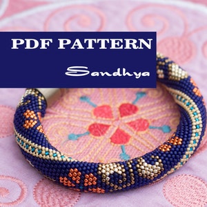 May include: PDF pattern for a beaded bracelet with a blue, gold, and orange color scheme. The pattern is titled "Sandhya".