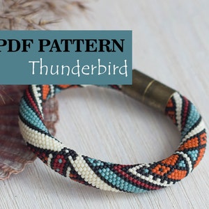May include: PDF pattern for a beaded bracelet with a Thunderbird design. The bracelet is made with white, black, red, orange, and blue beads. The bracelet has a metal clasp.
