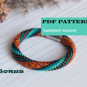 May include: A colorful beaded bracelet with a geometric pattern in shades of orange, turquoise, black, and white. The bracelet has a magnetic clasp and is labeled "PDF PATTERN Summer sunset".