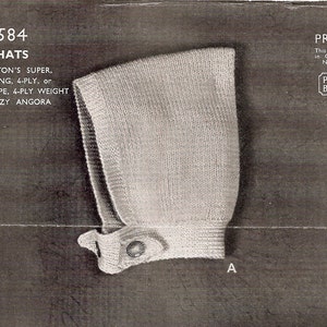 May include: A white knitted pixie hat with a button closure. The hat is made with Paton's Super, Scotch Fingering, or Paton's Super Crepe yarn. The pattern number is 2584.
