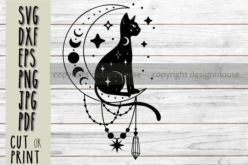 May include: Black silhouette of a cat sitting on a crescent moon with stars and a crystal pendant hanging from the bottom. The design is on a white wood background.