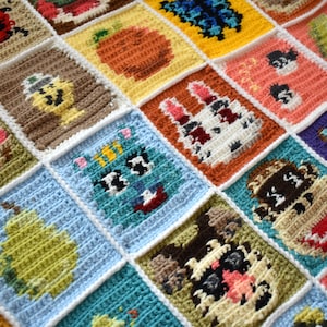 May include: A colorful crocheted blanket with various animal and nature-themed squares. The squares are stitched together with white yarn and feature different colors and textures.