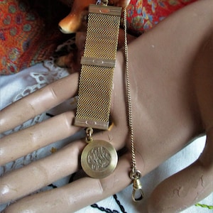 gold filled antique watch fob, woven style band, monogrammed  charm, lobster claw chain, Edwardian, circa 1910, classy, classic, steampunk