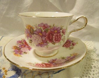 Queen Anne teacup and saucer, pink floral, footed gold trim, elegant handle,flower bouquet, summer tea  party, cottage chic, 40's vintage