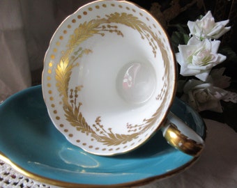 beautiful Aynsley tea cup and saucer, white and gold inside, blue outside, corset style, collectible, unusual, super condition, classic