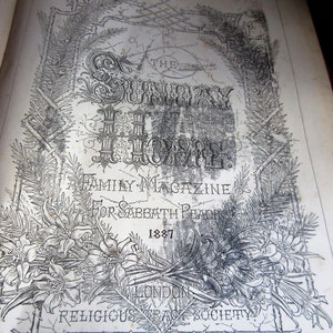 May include: A black and white image of a book cover for a magazine called 'Sunday at Home.' The cover features a decorative border of floral and leaf designs. The title is in large, bold letters and the subtitle is 'Family Magazine for Sabbath Reading.' The year 1887 is printed below the subtitle. The publisher information is printed at the bottom of the cover: 'London, Religious Tract Society, Paternoster Row 164 Piccadilly.'