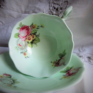 beautiful double warrant Paragon cup and saucer, pale green, inner floral design, wide mouth, excellent condition, classic, collectible