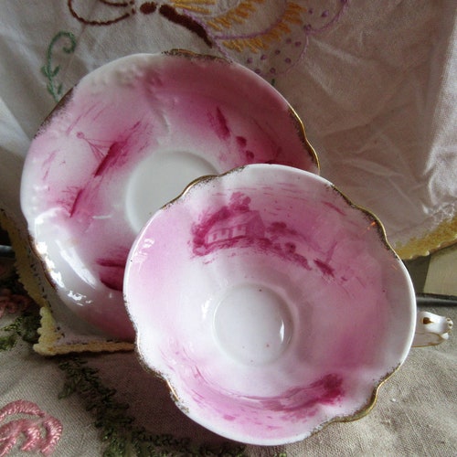 Late 1900's handpainted, signed cup and saucer, pink on white, windmill /ship/house, ruffled cup design, gold trim, shops excellent condition,rare
