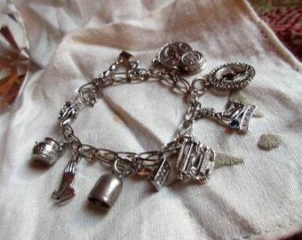 Sterling Silver Charm Bracelet with 12 Charms, Safety Clasp, Mid Century, 1960's Vintage, Fun to Wear, Instant History, Excellent Condition