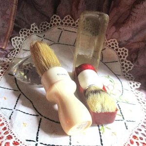 art deco shaving brushes, one with celluloid case, wooden handle, boar bristle, one with bakelite and boar bristle, 1930&#39;s unused, display
